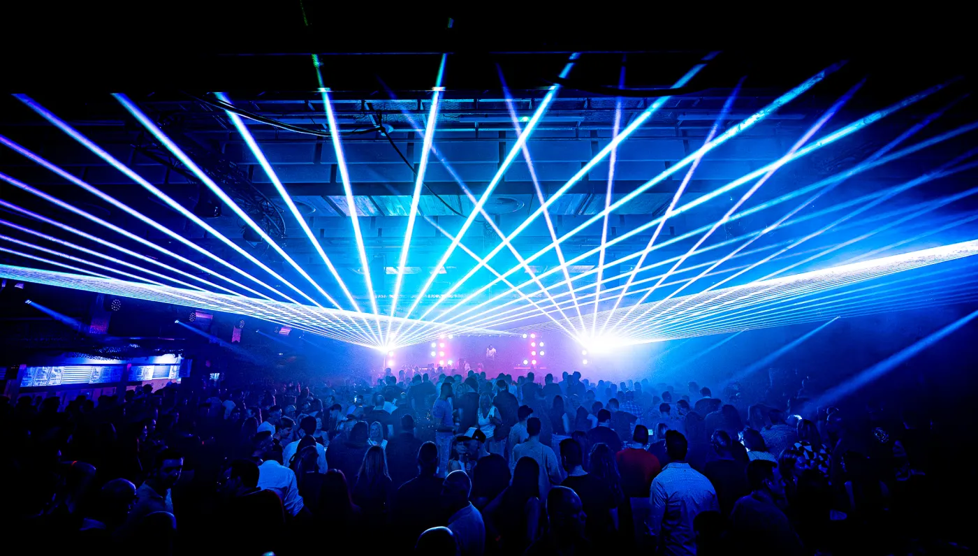 Cyan laser beams across the hall