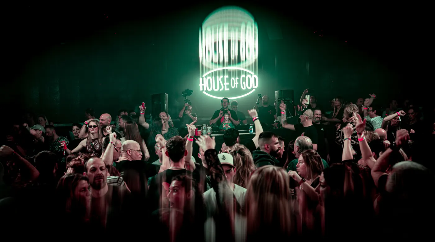 House of God logo projected over the crowd