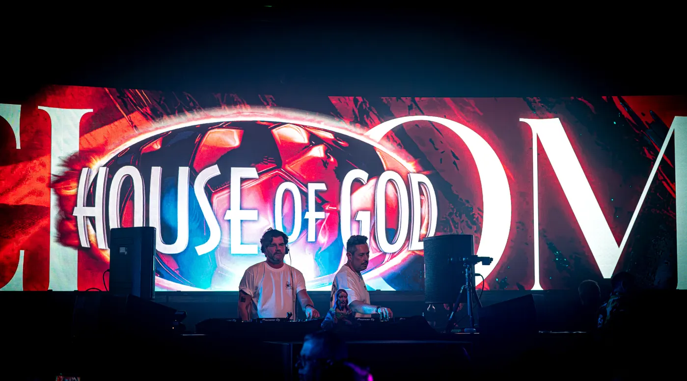 House of God sign behind the booth
